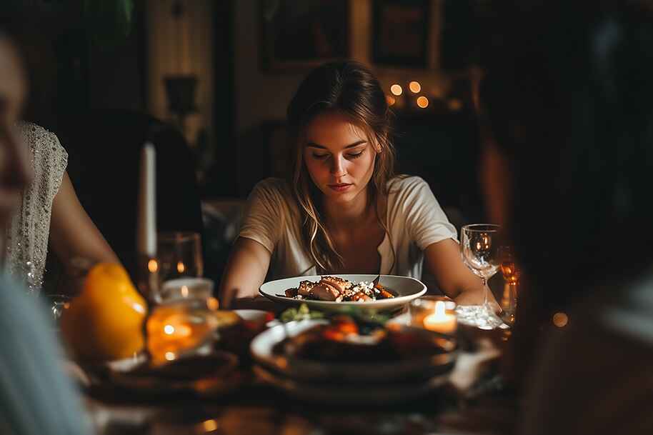 the girl dinner trend and thoughtful woman sitting at the table in a warm evening ambiance – a quiet moment before deciding to chase big wins with instant payouts at Eternal Slots.