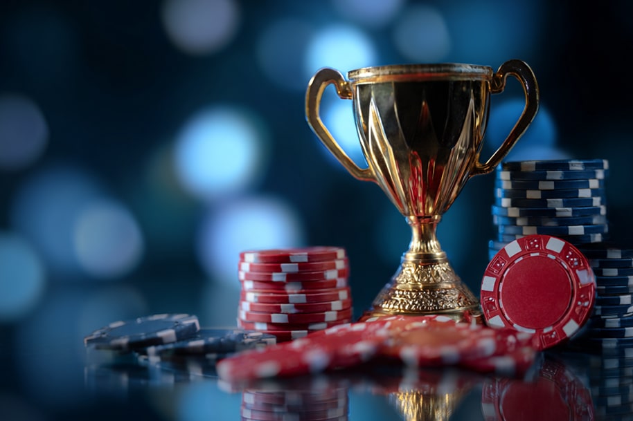 Casino tournament trophy with poker chips and real money prizes.