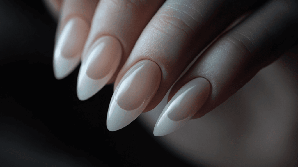 Smooth, translucent nails with a delicate half-moon fade, perfect for a minimalist look.