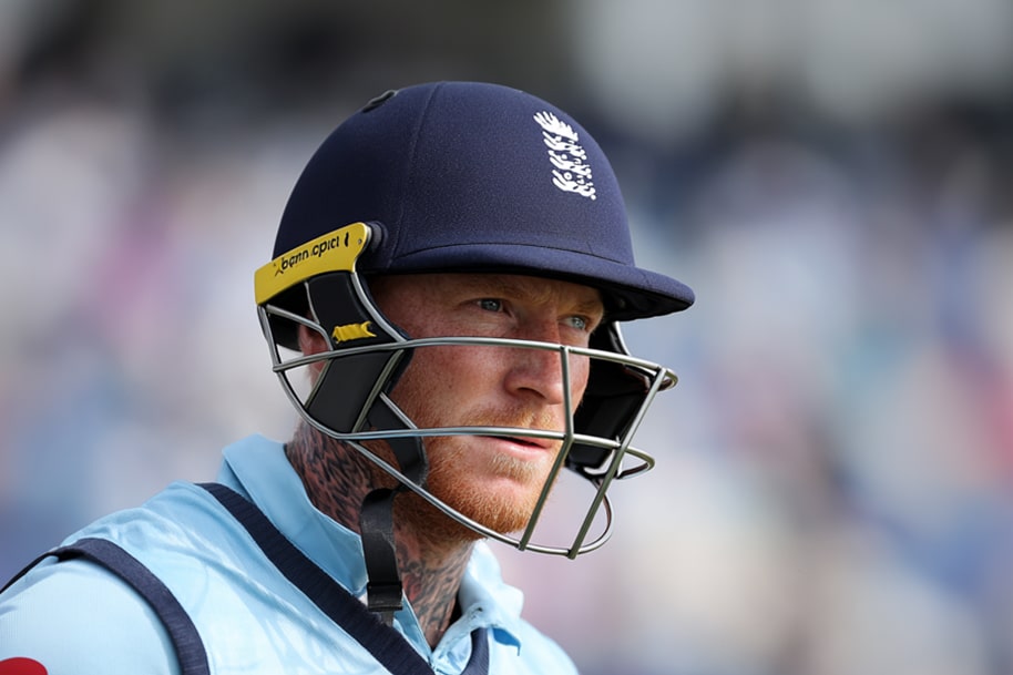 Ben Stokes wearing the England cricket uniform and helmet, fully focused and ready for play.