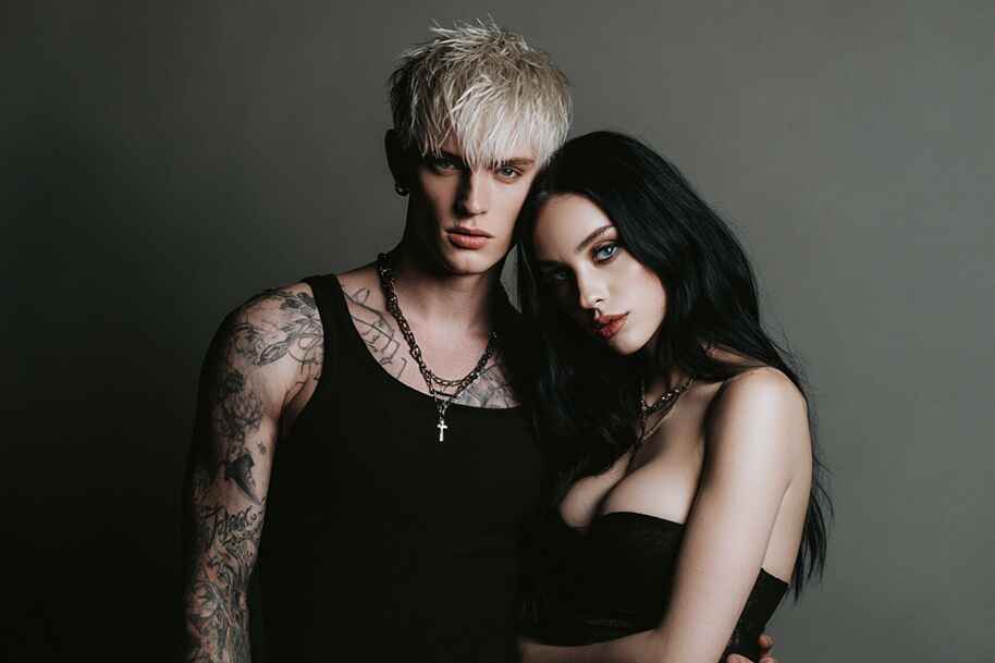 Edgy couple in dark fashion – symbolizing intense Scorpio and Pisces zodiac love match on Eternal Slots Casino astrology compatibility blog.