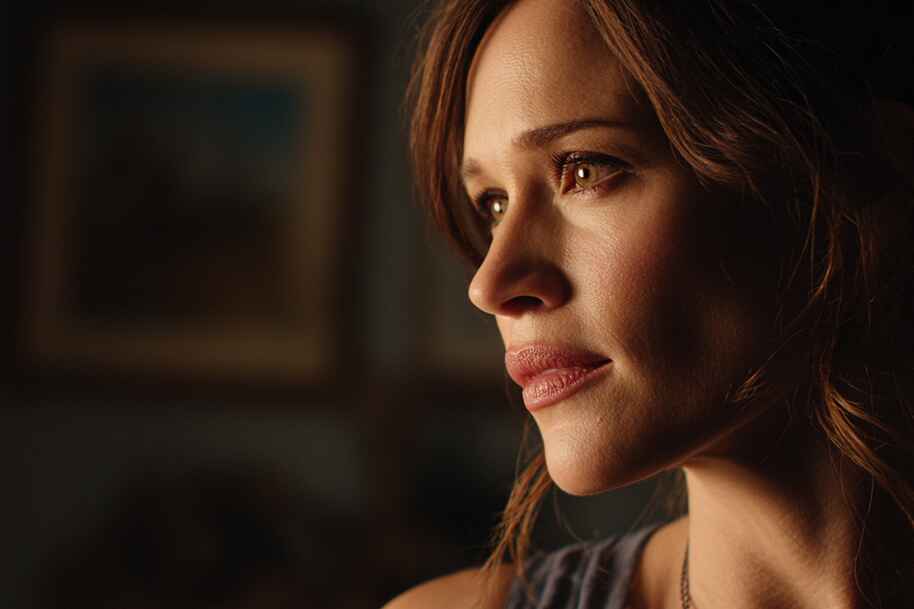 An intimate close-up of Jennifer Garner, showing her warm expression and inner strength with a soft glow.