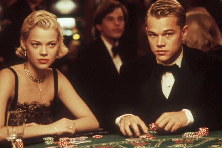 A young woman and a young man (Leonardo DiCaprio) sit at a poker table surrounded by chips, with the focus on the tense gaming atmosphere. That is one of the popular casino-themed movies.