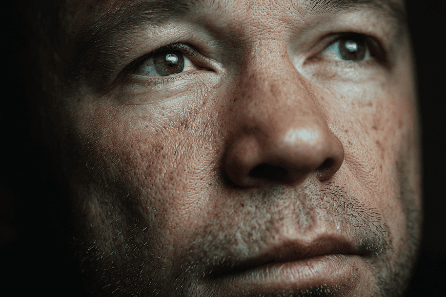 Close-up portrait of a man with raw emotions – powerful visual from Adolescence capturing vulnerability and struggle.
