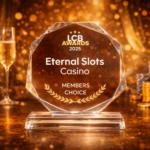 Eternal Slots Casino trophy for winning the LCB Members Choice Award 2025, displayed with champagne glasses and casino chips.